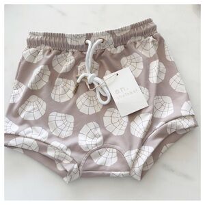 NWT Rylee + Cru baby swim trunk in the 'sea turtles' print and 'stone' hue
